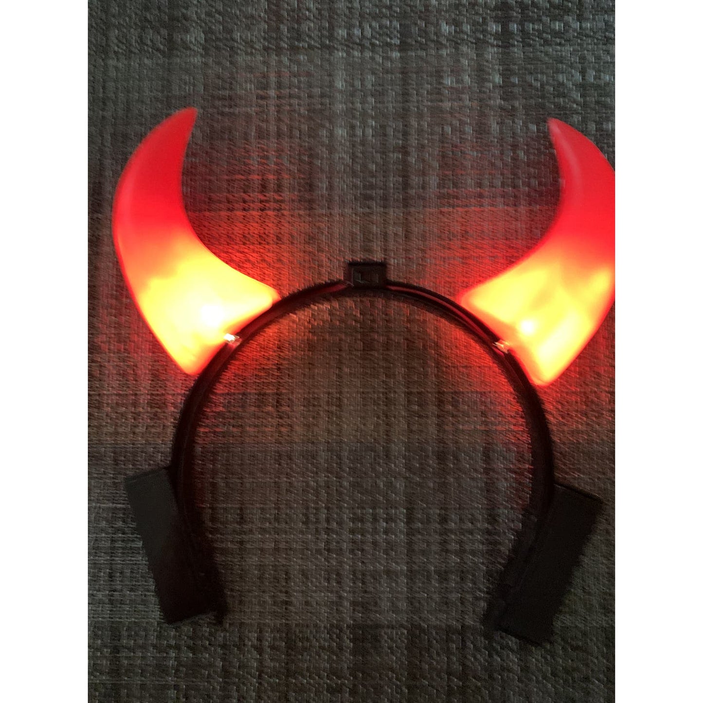 Devil Horns that light up. Each horn blinks. Battery operated.