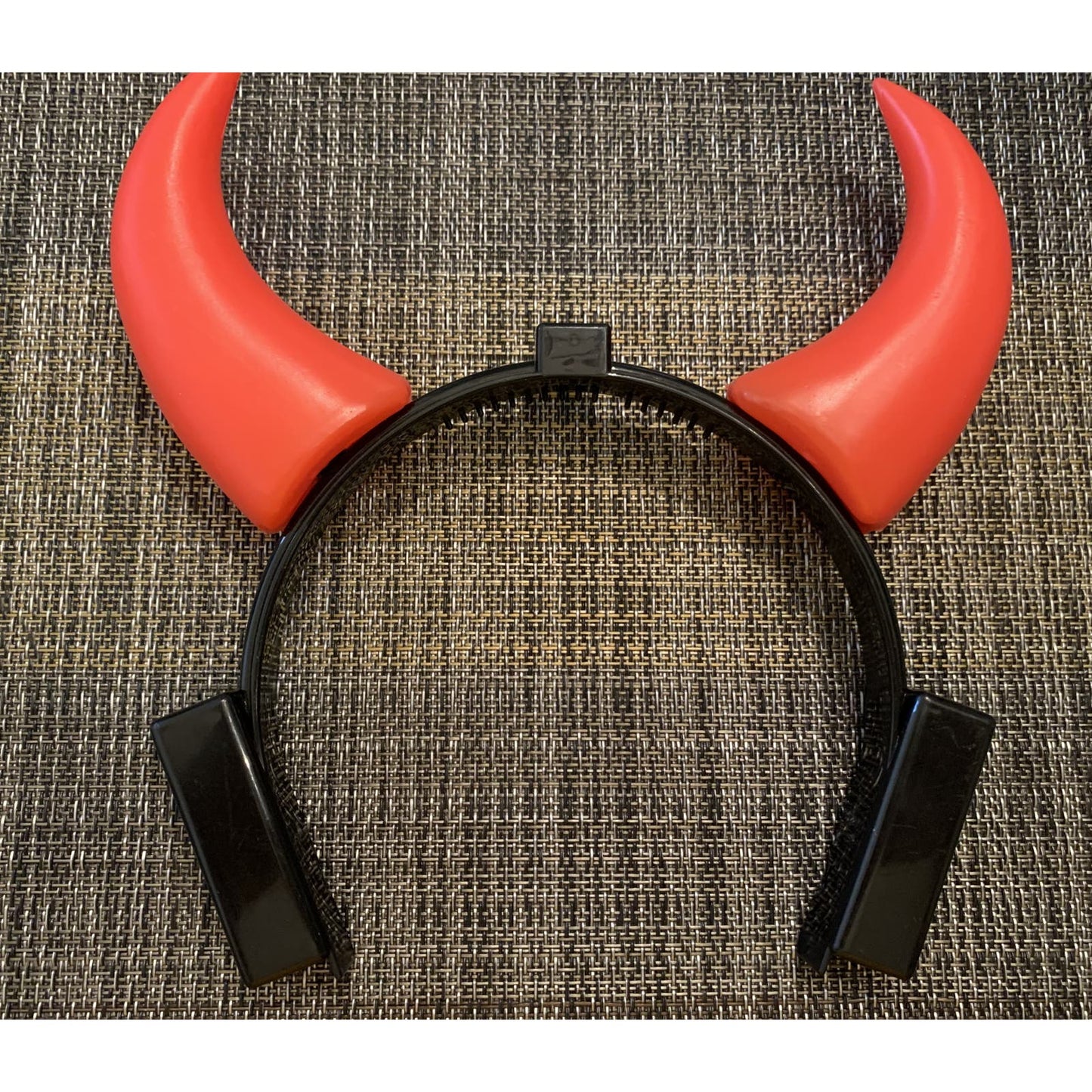 Devil Horns that light up. Each horn blinks. Battery operated.